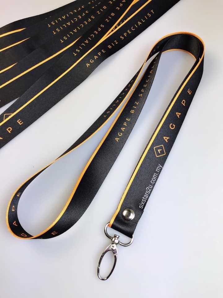 Custom black and gold printed lanyard with metal clip
